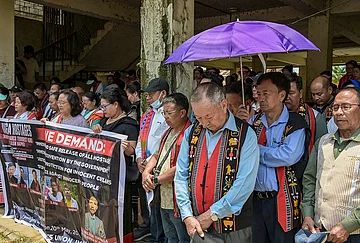 | Photo: PTI : People hold a banner and participate in a protest rally demanding the immediate release of six civilians allegedly held hostage by suspected Kuki militants, in Imphal, Manipur. More than 38 people were abducted and held hostage by armed groups in Kangpokpi and Senapati districts on May 13, hours after three church leaders were killed in an ambush in Kangpokpi district.
