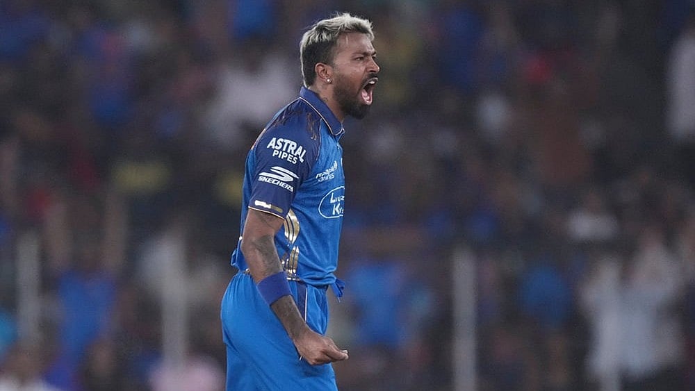 Mumbai Indians' captain Hardik Pandya celebrates the wicket of Gujarat Titans' Jos Buttler during the Indian Premier League cricket match between Gujarat Titans and Mumbai Indians in Ahmedabad. - | Photo: AP/Ajit Solanki