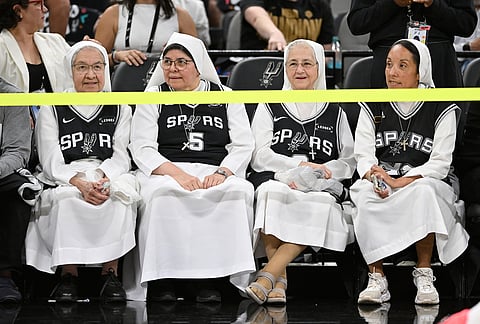 Spectators look on prior to Game 4 in the Western Conference finals NBA basketball playoffs series between the San Antonio Spurs and the Oklahoma City Thunder in San Antonio.