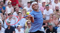 AP : Taylor Fritz of the U.S. in action against Nishesh Basavareddy during their first round men's singles tennis match at the French Open tennis tournament in Paris