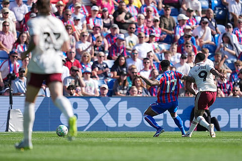 Arsenal's Gabriel Jesus, right, scores his side's opening goal during the English Premier League soccer match between Crystal Palace and Arsenal in London, England.