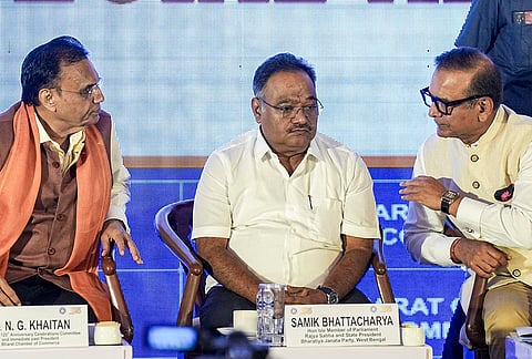 BJP West Bengal president and Rajya Sabha MP Samik Bhattacharya, centre, with Bharat Chamber of Commerce president Naresh Pachisia, right, and chairman of the 125th Anniversary Celebrations Committee of the Bharat Chamber of Commerce, N G Khaitan during a felicitation programme organised by the Bharat Chamber of Commerce, in Kolkata.