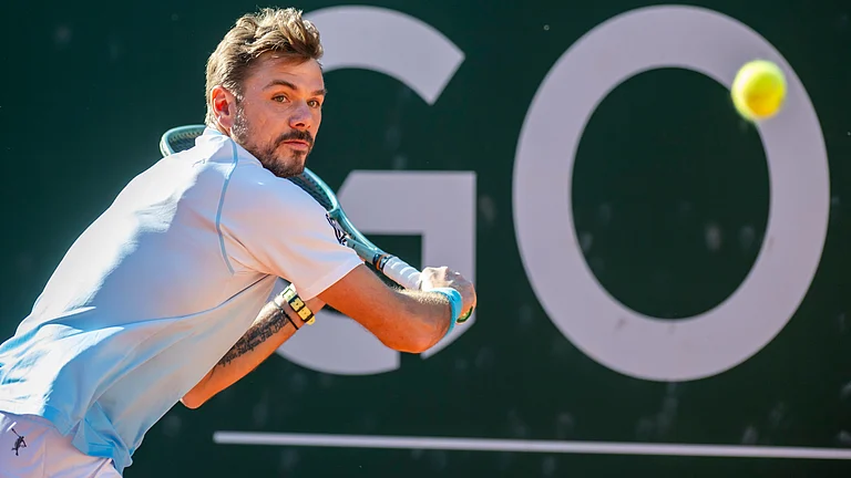 Stan Wawrinka from Switzerland, returns a ball to Alex Michelsen from the U.S., during their round of 16 game at the ATP 250 Geneva Open tournament, in Geneva, Switzerland, Wednesday, May 20, 2026. - | Photo: Martial Trezzini/Keystone via AP