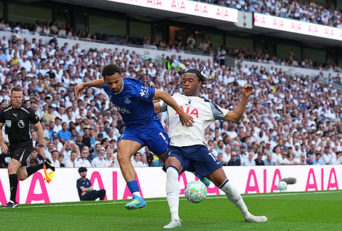 Everton's Iliman Ndiaye, left, and Tottenham's Destiny Udogie vie for the ball during the English Premier League soccer match between Tottenham Hotspur and Everton in London, England.
