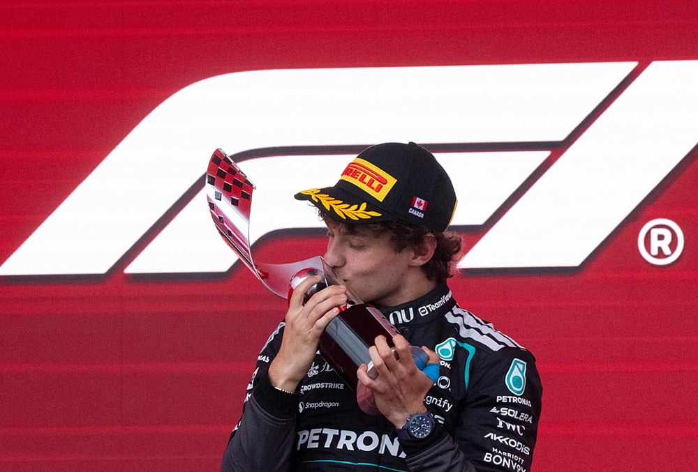 Mercedes driver Kimi Antonelli, of Italy, kisses his trophy following his win in the F1 Canadian Grand Prix auto race in Montreal. - | Photo: Christinne Muschi/The Canadian Press via AP