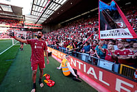 | Photo: Peter Byrne/PA via AP : Liverpool's Mohamed Salah takes a selfie with fans following his final Liverpool appearance in the Premier League match at Anfield, Liverpool, England.
