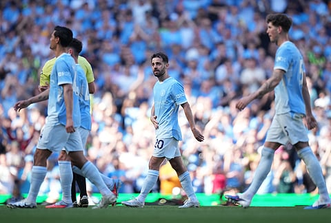 Manchester City's Bernardo Silva walks off the pitch as he played last match for the team during a Premier League soccer match between Manchester City and Aston Villa in Manchester, England.