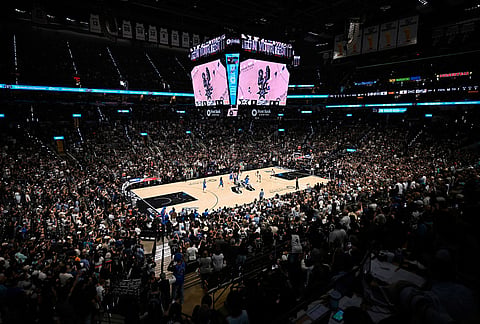 A crowd watches the opening tip-off during the first half of Game 4 in the Western Conference finals NBA basketball playoffs series between the San Antonio Spurs and the Oklahoma City Thunder in San Antonio.