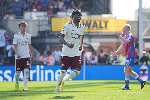 Arsenal's Noni Madueke celebrates after scoring his side's second goal during the English Premier League soccer match between Crystal Palace and Arsenal in London, England.