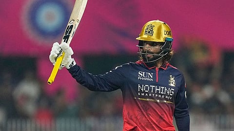Royal Challengers Bengaluru's captain Rajat Patidar celebrates his fifty runs during the Indian Premier League cricket match between Royal Challengers Bengaluru and Rajasthan Royals in Guwahati, India.