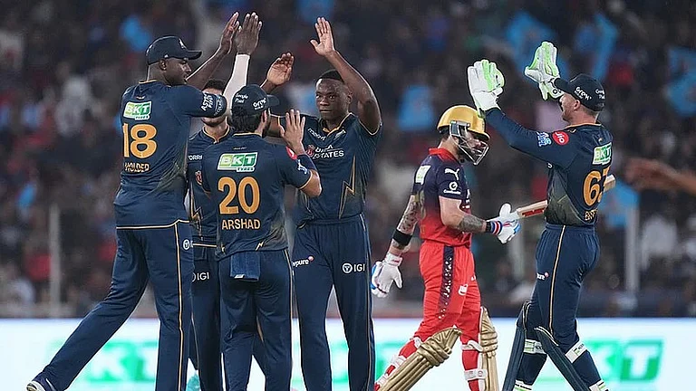Gujarat Titans' Kagiso Rabada celebrates with teammates the wicket of Royal Challengers Bengaluru's Virat Kohli during their Indian Premier League match in Ahmedabad. - File/AP