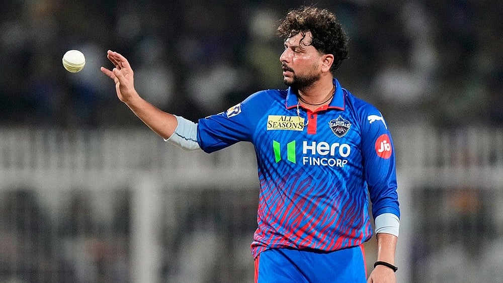 Delhi Capitals' Kuldeep Yadav receives the ball during the Indian Premier League cricket match between Delhi Capitals and Kolkata Knight Riders, in Kolkata, India. - | Photo: AP/Bikas Das