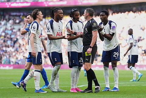 Tottenham's players protest to referee Michael Oliver during the English Premier League soccer match between Tottenham Hotspur and Everton in London, England.