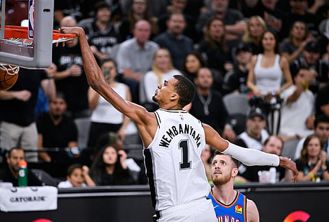San Antonio Spurs forward Victor Wembanyama (1) scores a basket on the Oklahoma City Thunder during the second half of Game 4 in the Western Conference finals NBA basketball playoffs series in San Antonio.