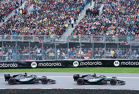 Mercedes driver Kimi Antonelli, right, of Italy, leads teammate Mercedes driver George Russell, of Britain, during the F1 Canadian Grand Prix auto race in Montrea.