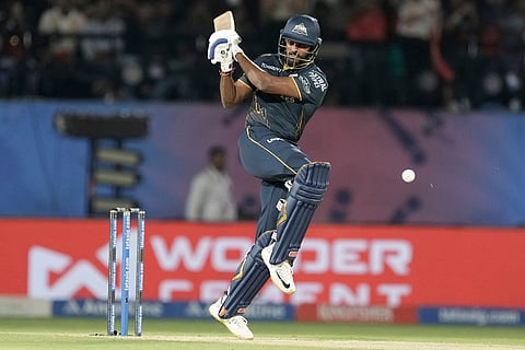 Gujarat Titans' Sai Sudharsan plays a shot during the Indian Premier League cricket match between Gujarat Titans and Royal Challengers Bengaluru in Dharamshala, India.