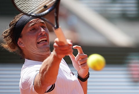 Alexander Zverev of Germany returns to Benjamin Bonzi of France during their first round men's singles tennis match at the French Open tennis tournament in Paris.