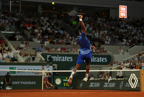 Gael Monfils of France returns to Hugo Gaston of France during their first round men's singles tennis match at the French Open tennis tournament in Paris.