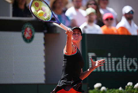 Anna Bondar of Hungary returns to Elina Svitolina of Ukraine during their first round women's singles tennis match at the French Open tennis tournament in Paris.