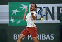 | Photo: AP/Aurelien Morissard : Hugo Gaston of France returns to Gael Monfils of France during their first round men's singles tennis match at the French Open tennis tournament in Paris.