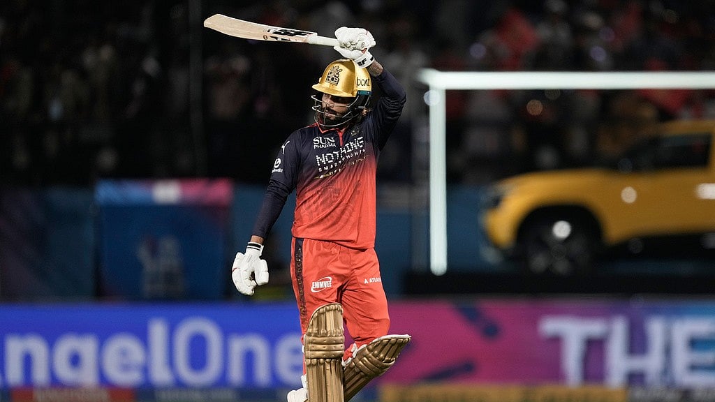 AP/Ashwini Bhatia : Rajat Patidar celebrates his fifty during the Indian Premier League match between Gujarat Titans and Royal Challengers Bengaluru in Dharamsala.
