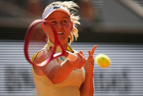Fiona Ferro of France returns to Mirra Andreeva of Russia during their first round women's singles tennis match at the French Open tennis tournament in Paris.