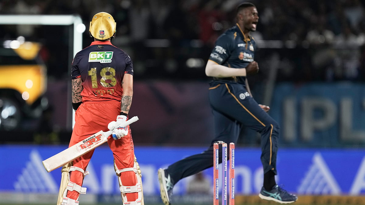 Gujarat Titans' Jason Holder, right, celebrates the dismissal of Royal Challengers Bengaluru's Virat Kohli, left, during the Indian Premier League cricket match between Gujarat Titans and Royal Challengers Bengaluru in Dharamshala. - AP Photo