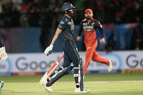 Gujarat Titans' captain Shubman Gill reacts as he walks off the field after losing his wicket during the Indian Premier League cricket match between Gujarat Titans and Royal Challengers Bengaluru in Dharamshala, India, Tuesday, May 26, 2026. ()