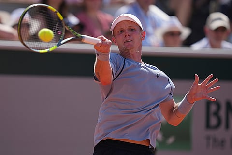 Jesper De Jong of the Netherlands returns to Stan Wawrinka of Switzerland during their first round men's singles tennis match at the French Open tennis tournament in Paris.
