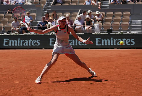 Elena Rybakina of Kazakhstan returns to Veronika Erjavec of Slovenia during their first round women's singles tennis match at the French Open tennis tournament in Paris.