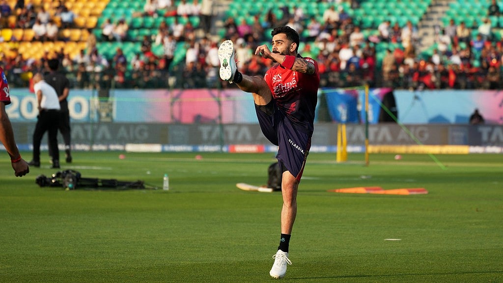 Virat Kohli warms up before the start of the Indian Premier League match between Gujarat Titans and Royal Challengers Bengaluru in Dharamsala. - Photo: AP/Ashwini Bhatia