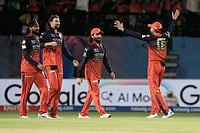 | Photo: AP/Ashwini Bhatia : Royal Challengers Bengaluru's Virat Kohli, right, and teammates celebrate after their win in the Indian Premier League cricket match against Gujarat Titans in Dharamshala, India.