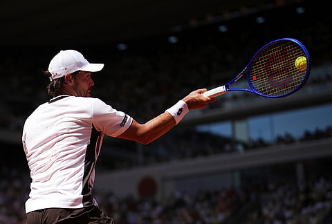 Benjamin Bonzi of France returns to Alexander Zverev of Germany during their first round men's singles tennis match at the French Open tennis tournament in Paris.