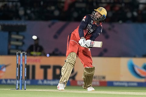 Royal Challengers Bengaluru's Venkatesh Iyer bats during the Indian Premier League cricket match between Gujarat Titans and Royal Challengers Bengaluru in Dharamshala, India.