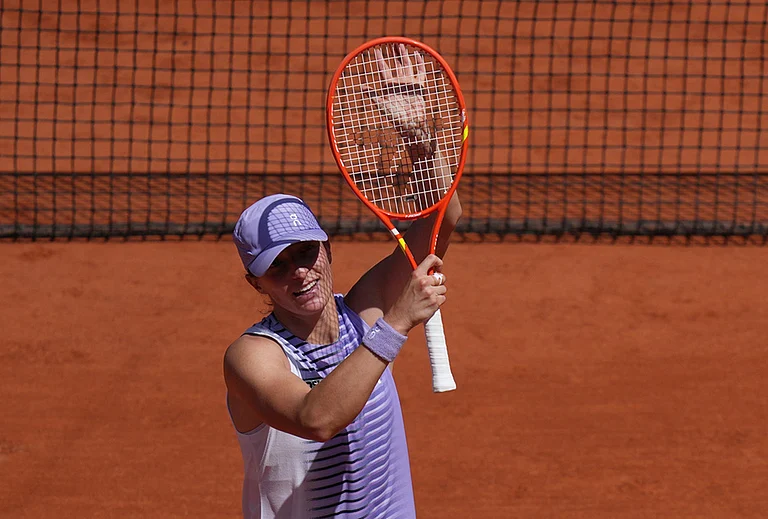 Iga Swiatek of Poland celebrates winning against Emerson Jones of Australia during their first round women's singles tennis match at the French Open tennis tournament in Paris. - | Photo: AP/Thibault Camus