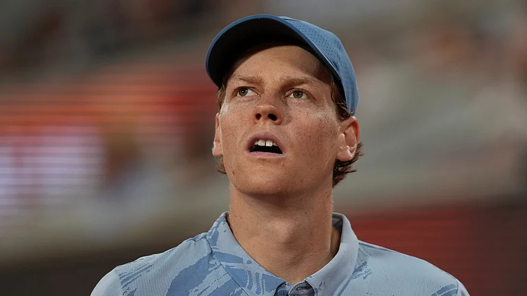 Jannik Sinner of Italy reacts as he plays against Clement Tabur of France during their first round men's singles tennis match at the French Open tennis tournament in Paris. - AP Photo