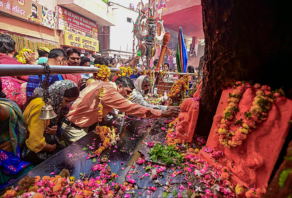 People offer prayers at Bade Hanuman temple