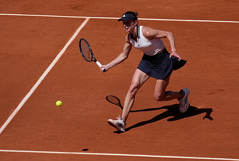 Elina Svitolina of Ukraine returns to Anna Bondar of Hungary during their first round women's singles tennis match at the French Open tennis tournament in Paris.
