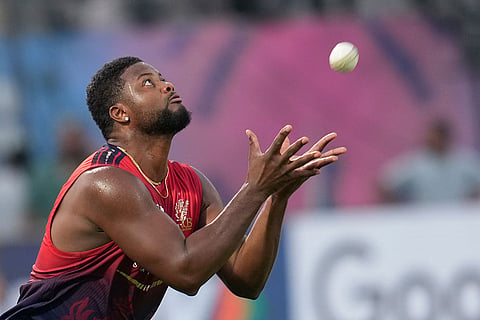 Royal Challengers Bengaluru's Romario Shephard during a practice session ahead of an Indian Premier League (IPL) 2026 T20 first qualifier cricket match between Royal Challengers Bengaluru and Gujarat Titans, in Dharamshala, Himachal Pradesh.