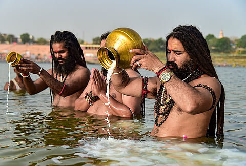 Mahant of Baghambari Math Balveer Giri Maharaj along with other sages offers prayers at Sangam on ‘Ganga Dussehra’, in Prayagraj, Uttar Pradesh.