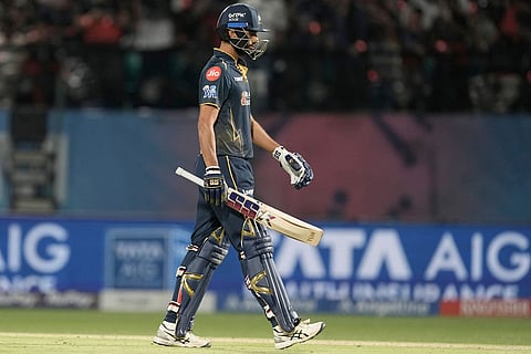 Gujarat Titans' Washington Sundar walks off the field after losing his wicket during the Indian Premier League cricket match between Gujarat Titans and Royal Challengers Bengaluru in Dharamshala, India.