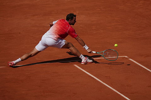 Stan Wawrinka of Switzerland returns to Jesper De Jong of the Netherlands during their first round men's singles tennis match at the French Open tennis tournament in Paris.