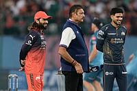 RCB Vs GT, IPL 2026 Qualifier 1: See Best Photos From Indian Premier League Playoff Match At Dharamsala's HPCA Stadium | Photo: AP/Ashwini Bhatia : Royal Challengers Bengaluru's captain Rajat Patidar, left, Gujarat Titans' captain Shubman Gill, right, and commentator Ravi Shastri wait for the coin toss ahead of the Indian Premier League cricket match between Gujarat Titans and Royal Challengers Bengaluru in Dharamshala, India.