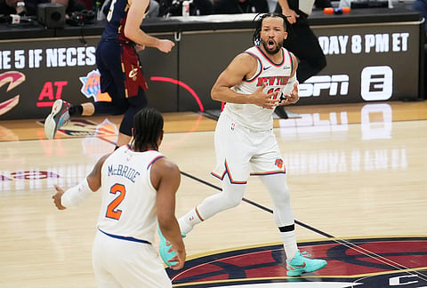 New York Knicks guard Jalen Brunson (11) celebrates with guard Miles McBride (2) during the second half of Game 4 in the Eastern Conference finals NBA basketball playoffs series against the Cleveland Cavaliers in Cleveland.