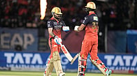 AP/Ashwini Bhatia : Virat Kohli, left, and batting partner Devdutt Padikkal in action during the Indian Premier League match between Gujarat Titans and Royal Challengers Bengaluru in Dharamsala.