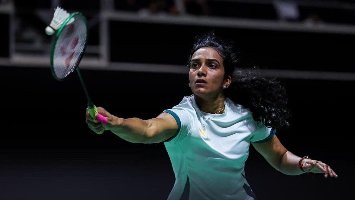 PV Sindhu in action against Putri Kusuma Wardani at the Singapore Open. - Badminton Photo
