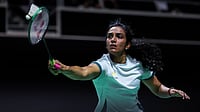 Badminton Photo : PV Sindhu in action against Putri Kusuma Wardani at the Singapore Open.