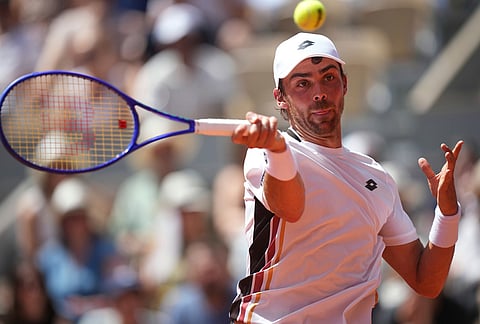 Benjamin Bonzi of France returns to Alexander Zverev of Germany during their first round men's singles tennis match at the French Open tennis tournament in Paris.