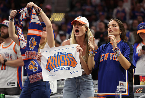 New York Knicks fans cheer during the second half of Game 4 in the Eastern Conference finals NBA basketball playoffs series against the Cleveland Cavaliers in Cleveland.