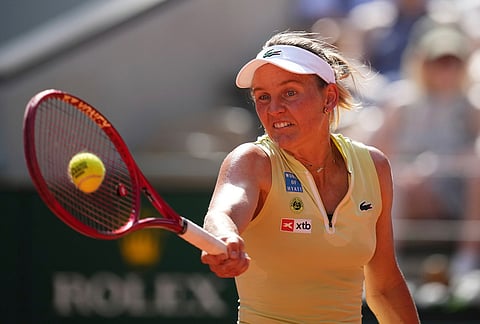 Fiona Ferro of France returns to Mirra Andreeva of Russia during their first round women's singles tennis match at the French Open tennis tournament in Paris.